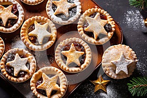 Traditional British Christmas Pastry Home Baked Mince Pies with Apple Raisins Nuts Filling on rustic wood table.