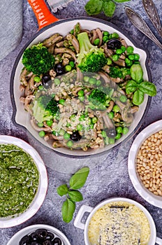 Traditional brown pasta with green vegetables