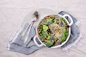 Traditional brown pasta with green vegetables