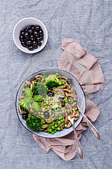 Traditional brown pasta with green vegetables