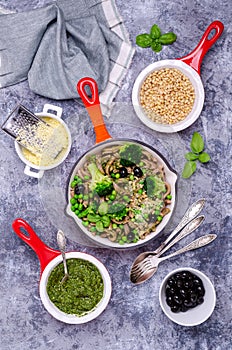 Traditional brown pasta with green vegetables