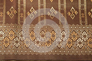 Traditional brown Thai fabric pattern