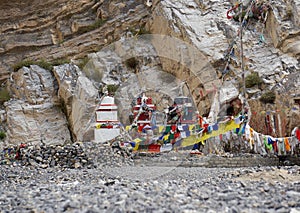 Traditional Buddhist chortens stand in the Himalayan mountains in the place of worship of the gods.