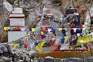 Traditional Buddhist chortens stand in the Himalayan mountains.