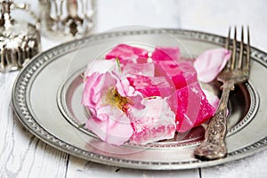 Traditional bulgarian rose lokum on a blue plate