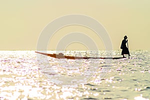 Traditional Burmese fisherman at Inle lake, Myanmar famous for their distinctive one legged rowing style