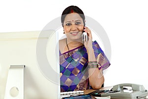 Traditional business woman talking on mobile phone