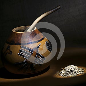 Traditional calabash gourd with bombilla and yerba mate