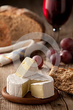 Traditional Camembert cheese with homemade bread photo