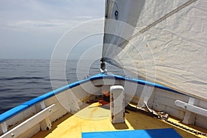 Traditional Caribbean Sloop, Sail and Prow view of Caribbean Ocean.