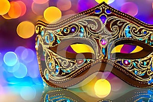 Traditional carnival venetian mask on bokeh background