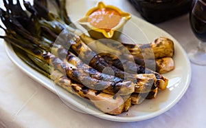 Roasted calcots with romesco sauce photo