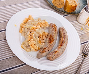 Traditional Catalan dish stewed beans with sausage. Butifarra con alubias photo