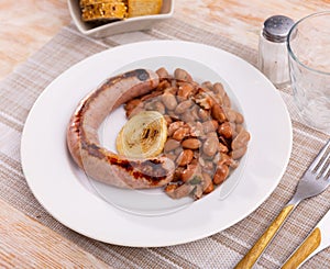 Traditional Catalan dish stewed beans with sausage. Butifarra con alubias photo