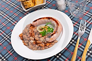 Traditional Catalan dish stewed beans with sausage. Butifarra con alubias photo