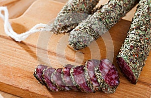 Fuet sausage coated with herbs