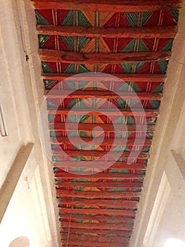 Traditional ceiling made of palm tree tranks and branches of  Nerium oleander