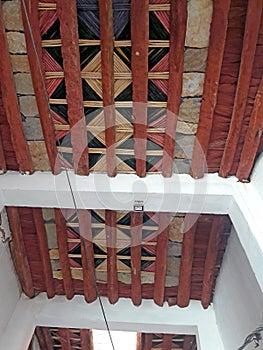 Traditional ceiling made of palm tree tranks and branches of  Nerium oleander