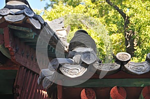 Traditional ceiling tiles of Korean Hanok Village building with old wooden roof in the afternoon in Seoul, South Korea