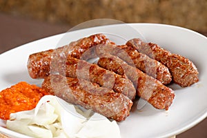 Traditional cevapcici with ajvar paste