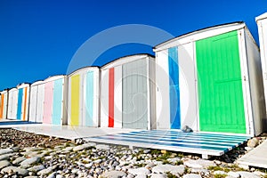 Traditional changing rooms on the beach photo