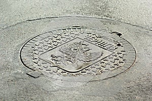Traditional Chernihiv manhole cover or drain lid with the city eagle symbol