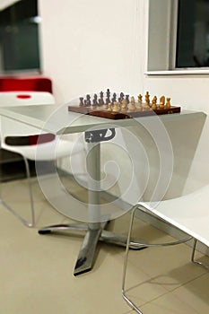 The traditional chess piece on chess board ready to play.