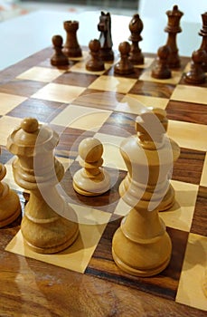 The traditional chess piece on chess board ready to play.