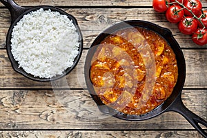Traditional chicken tikka masala Indian spicy meat food with rice