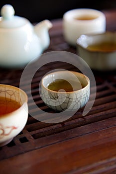 Traditional china tea and celadon cups on tabl