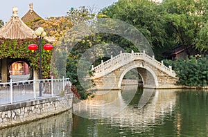 Traditional chinese arch bridge in Renmin park in Tianjin