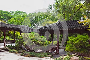 Traditional Chinese architecture among trees on Tiger Hill Huqiu, Suzhou, Jiangsu, China