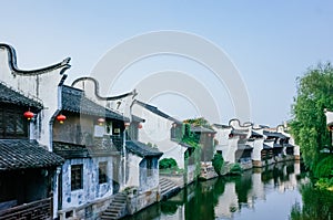 Traditional Chinese black and white houses by river, in downtown Jiaxing, China