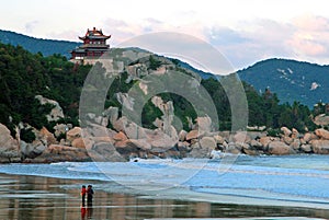 Traditional Chinese building on cliff of the shore of East C