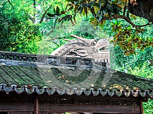 Traditional chinese building with ornate roof and red windows at Yu Gardens, Shanghai, China