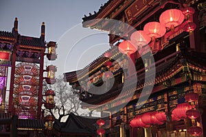 Traditional Chinese buildings illuminated at dusk in Beijing, China