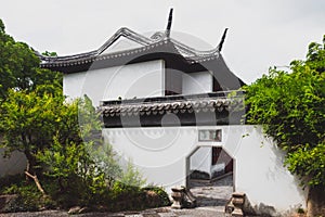 Traditional Chinese house and octagonal gate on Tiger Hill Huqiu, Suzhou, Jiangsu, China