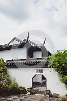 Traditional Chinese house and octagonal gate on Tiger Hill Huqiu, Suzhou, Jiangsu, China