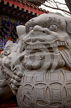 Traditional Chinese lion at the entrance of the temple in Shandong, Penglai pavilion