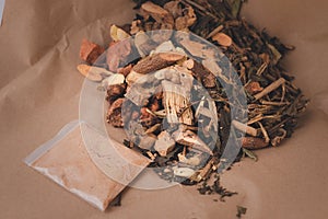 Traditional Chinese medicine herb ingredient on brown paper background