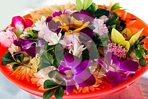 Traditional Chinese offerings to the gods in Taiwan with flowers and incense sticks