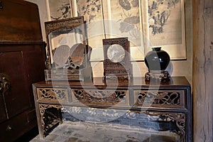 Traditional Chinese Residences interior wooden carving table and decorations in Tianshui Folk Arts Museum Hu Shi folk house, Gansu