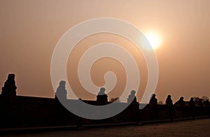 Traditional Chinese Stone Lion Silhouette on Marco Polo Bridge photo