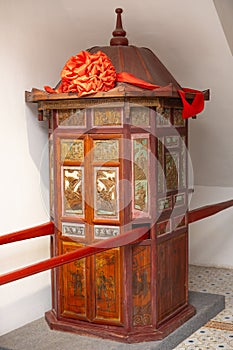 a traditional Chinese style palanquin at vertical composition