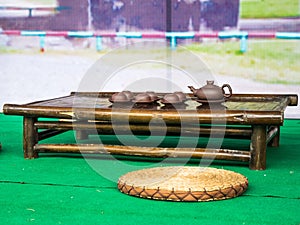 Traditional chinese tea ceremony accessories (tea cups and pitcher) on the tea table