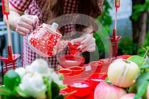 Traditional Chinese tea sets in wedding day. Pouring tea in a Chinese wedding. The Chinese text in the photo is pronounced Shuang