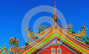 Traditional Chinese Temple roof with mountain and blue sky background of Jiufen, Ruifang, Taiwan