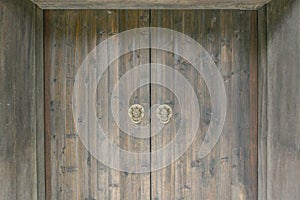 Traditional Chinese wooden doors with lion head door knockers