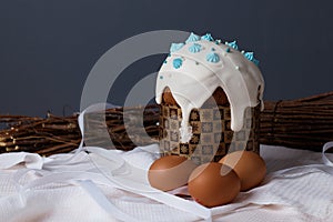 traditional Christian holiday, Easter cakes and eggs on the table dry plants, willow