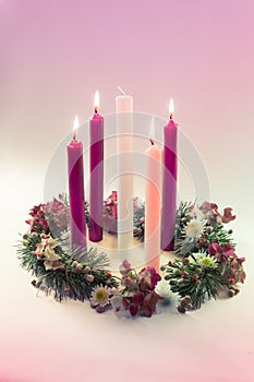 Traditional christian religious advent wreath with 5 candles, 4 candles burning